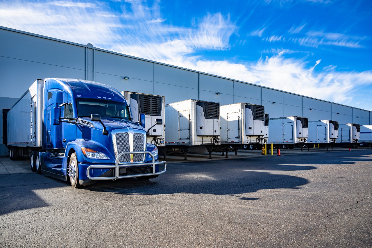 Refrigerated trailers at a temperature-controlled distribution facility loading dock