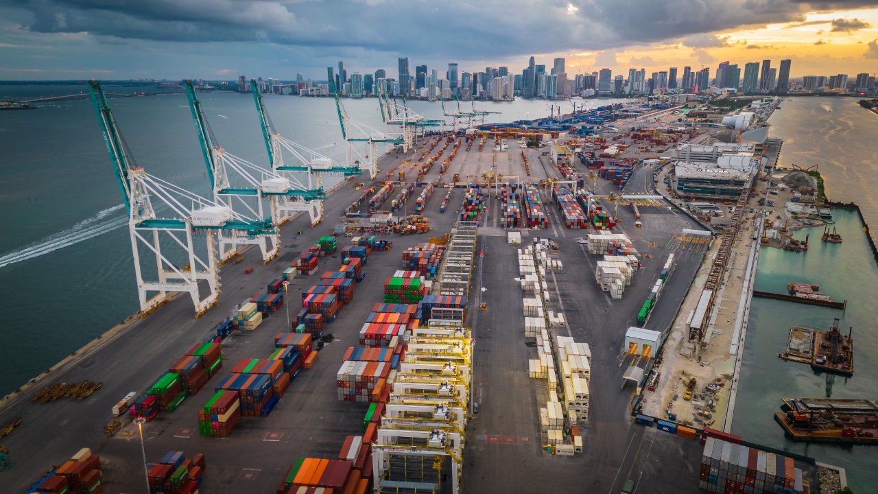 Aerial view of a container terminal with city skyline
